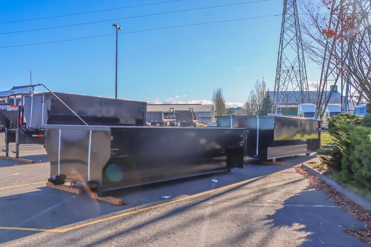 Roll-off dumpster ready for waste disposal at job site for Yard Waste Dumpster Rental in Salem